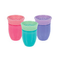 Three Nuby 360 Wonder Cups (3 Pack - 7 oz) in purple, pink, and aqua stand upright with matching lids against a white background. These colorful, spoutless cups have soft, spill-proof rims—perfect for little ones.