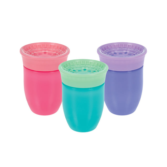 Three Nuby 360 Wonder Cups (3 Pack - 7 oz) in purple, pink, and aqua stand upright with matching lids against a white background. These colorful, spoutless cups have soft, spill-proof rims—perfect for little ones.