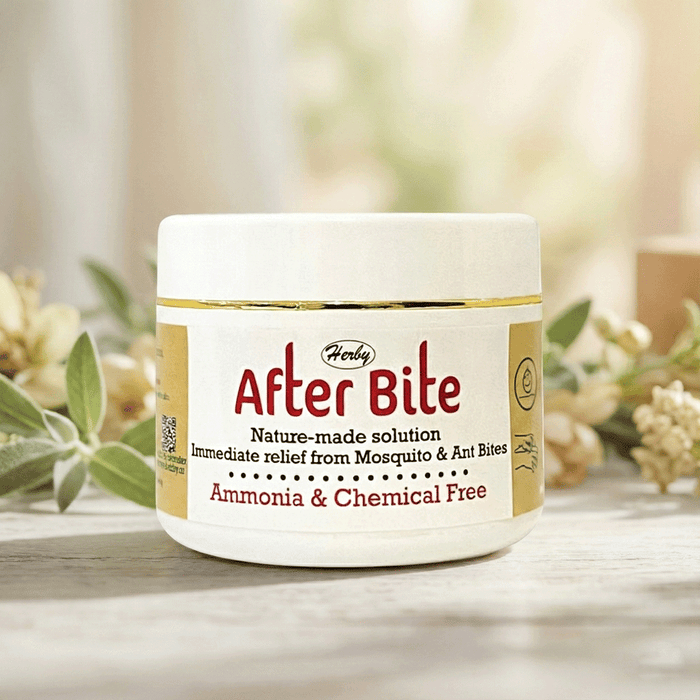 Herby After Bite cream jar on a table with greenery, offering instant relief from mosquito and ant bites.