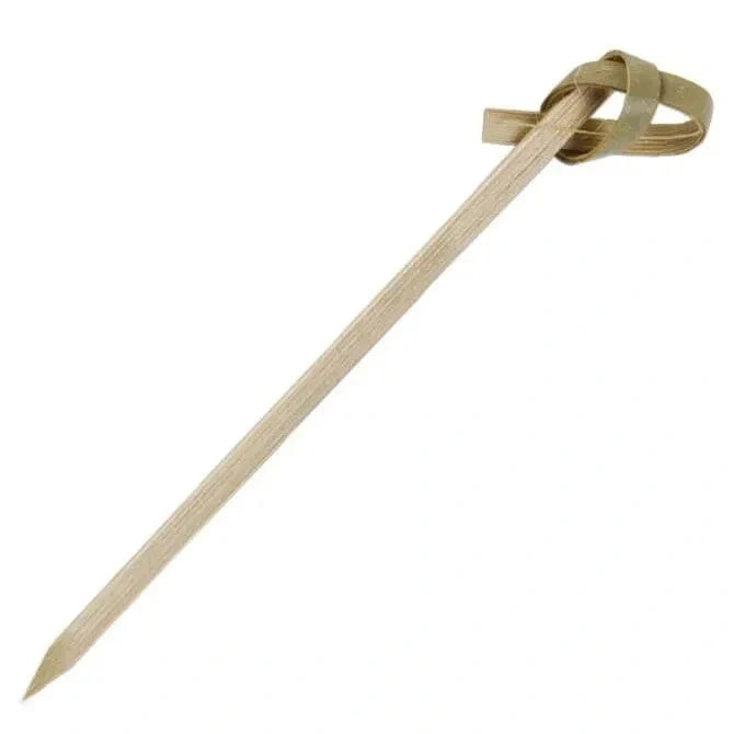 Wooden bamboo skewer with a knot on a white background