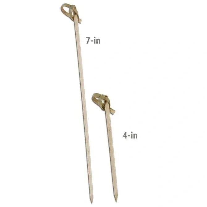 Two wooden skewers with measurements 7" and 4" on a white background.
