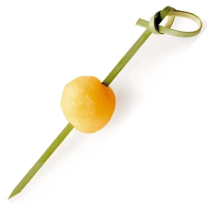 Yellow fruit with a green stem on a white background