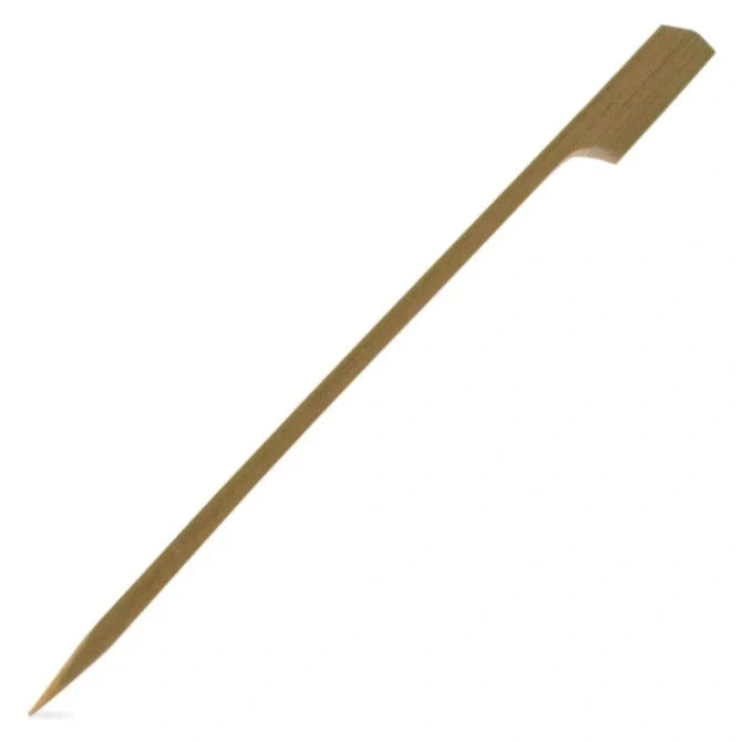 A single bamboo paddle pick, with a flat paddle-like end and a pointed tip, against a white background.