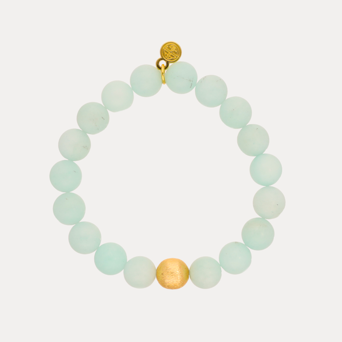 a bracelet with a gold bead