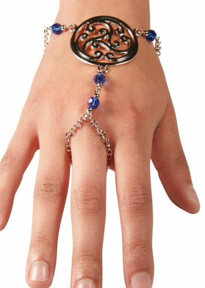 Silver Celtic spiral knot hand chain finger bracelet with blue bead accents worn on hand