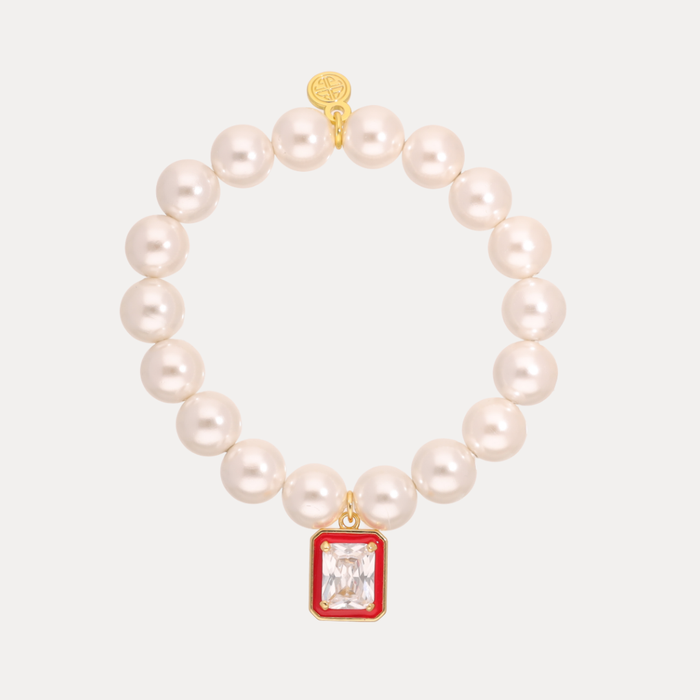 a pearl bracelet with a red square pendant