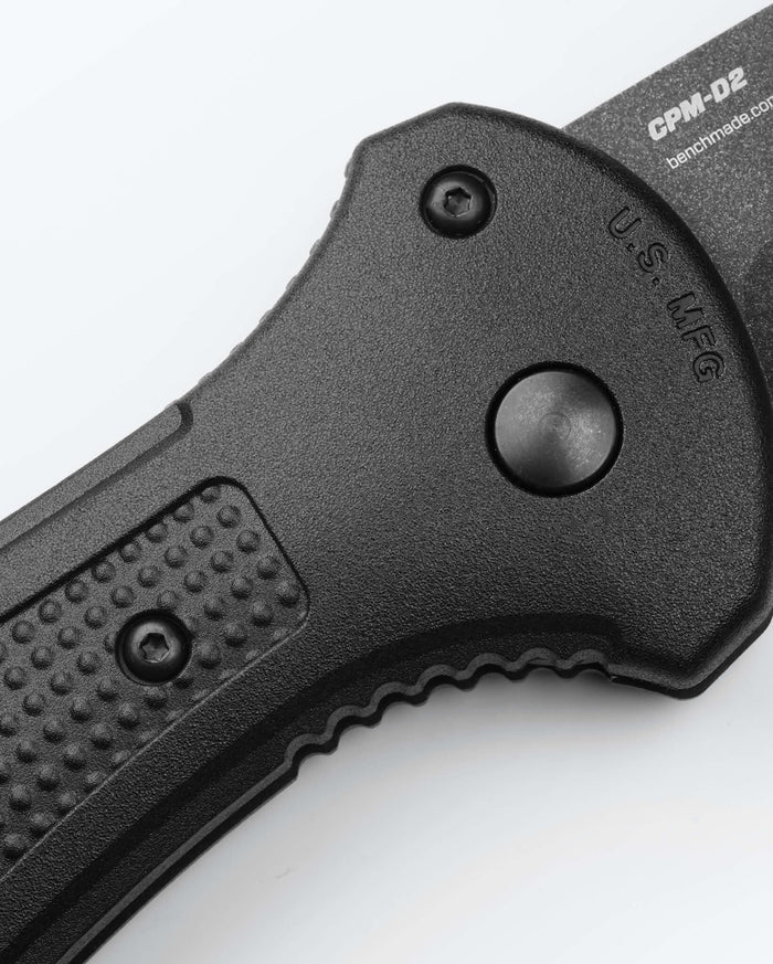Black Benchmade Claymore Handle Detail - Push Button & Texturing Close-up | Benchmade Knife Co.