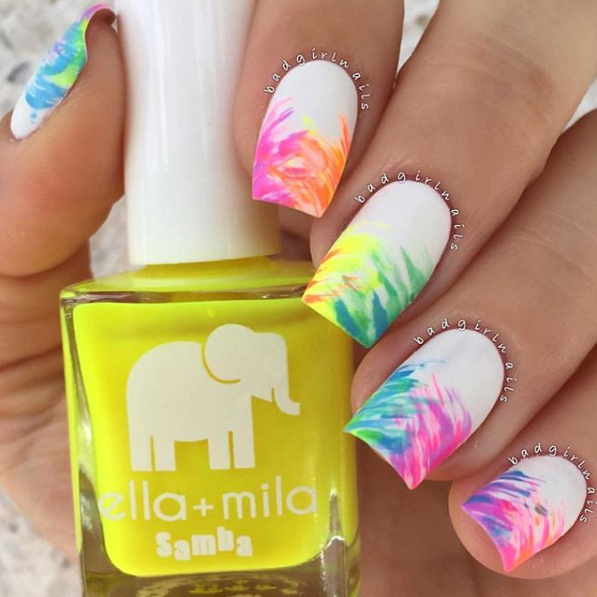 Copabikini yellow nail polish with white and rainbow tie-dye nail art