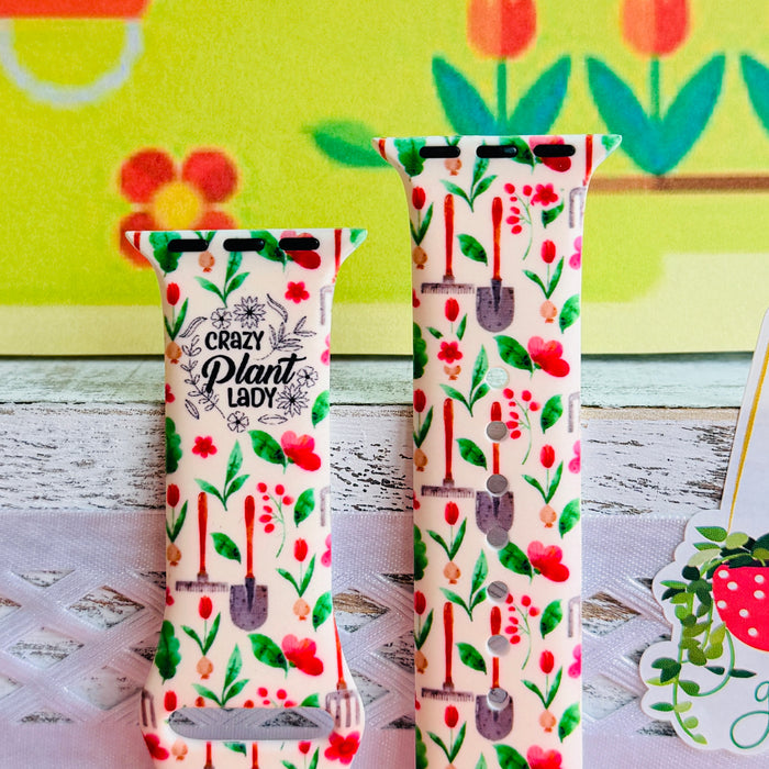 Crazy Plant Lady Apple Watch band with gardening tools, red flowers, and green leaves on cream background with garden decorations