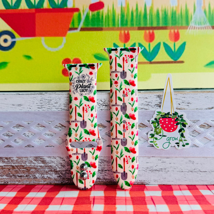 Crazy Plant Lady Apple Watch band with gardening tools, red flowers, and green leaves on cream background with garden decorations
