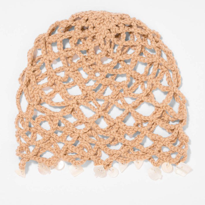 Neutral beige crochet beanie with shell accents for effortless coastal-inspired looks.