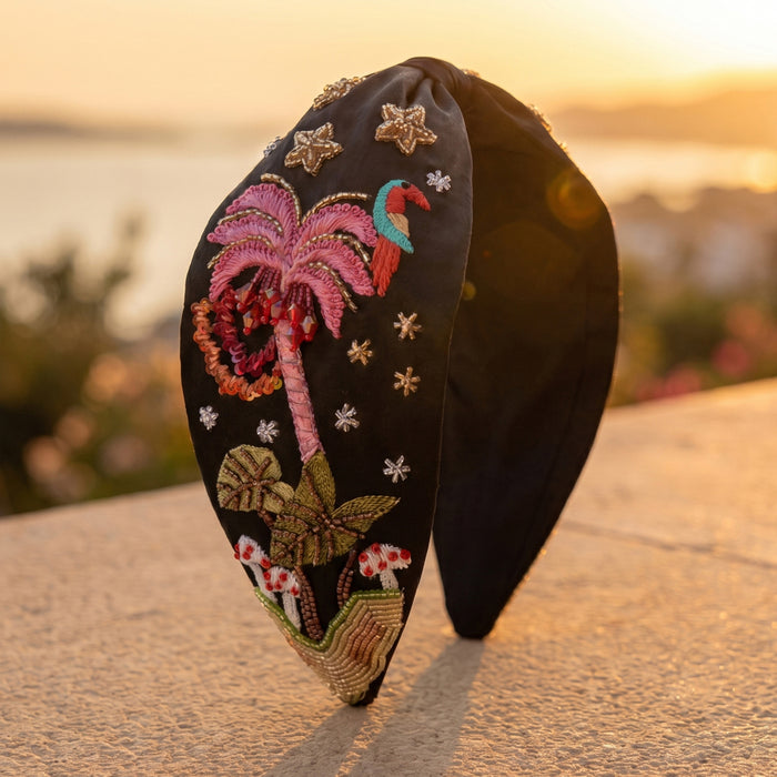 Hand-embroidered tropical bird headband with sequins and crystals on rich black satin base