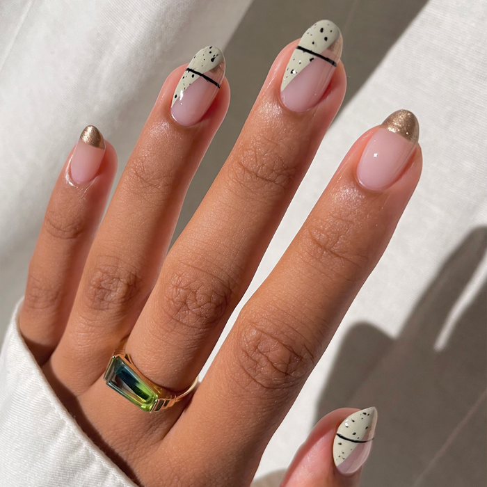 Enchanted Collection sage green outline French tip nail art on a medium skin tone with a ring