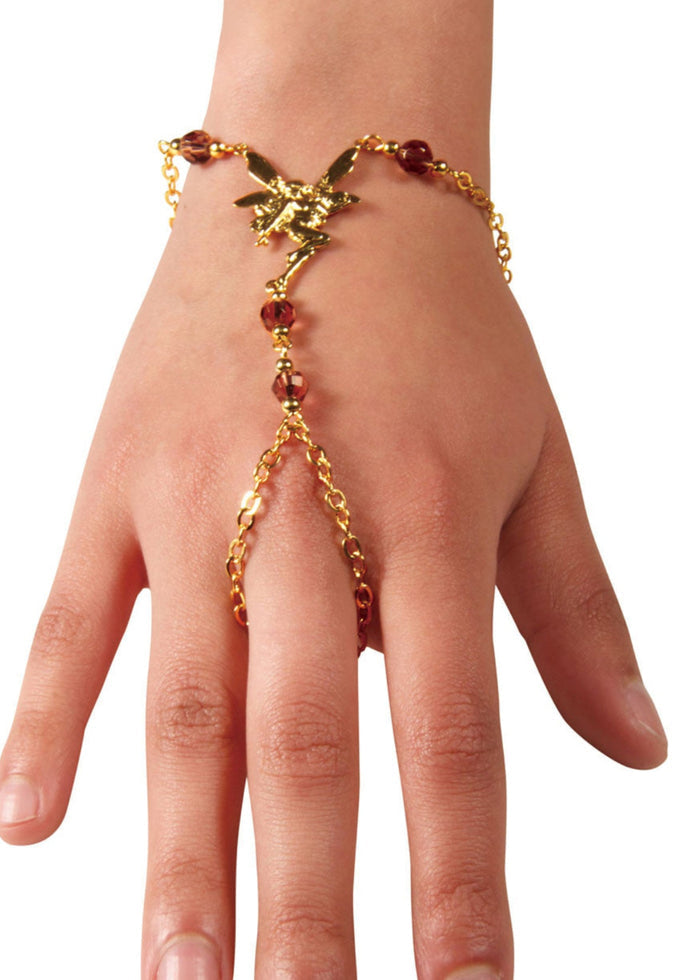 Gold fairy hand chain finger bracelet with red bead accents worn on hand