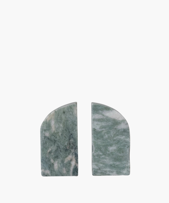Two green marble bookends with rounded tops and white marbling. They are placed side by side against a plain white background, conveying elegance and simplicity. | SW Home