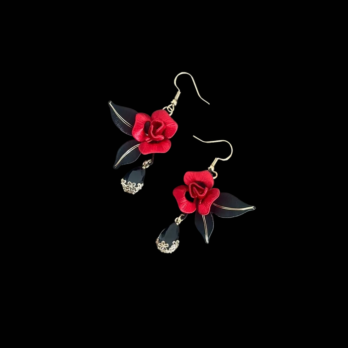 Handcrafted Chanhua thread-wrapped earrings featuring a blooming red rose with black leaves and black teardrop dangles.
