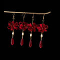 Handcrafted Chanhua thread-wrapped earrings in a red Spider Lily design with white pearls and deep red teardrop drops.