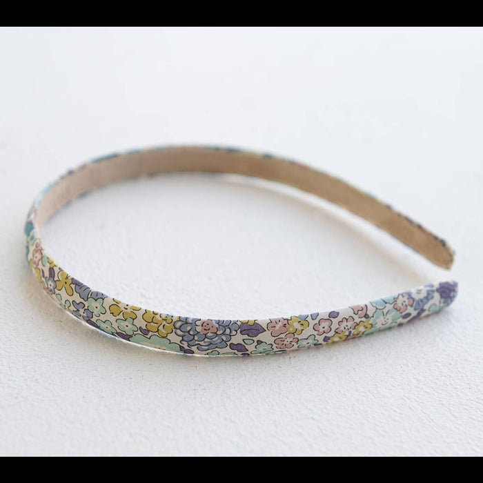 Floral patterned headband on a white background