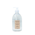 A clear plastic bottle with a pump dispenser, labeled as Authentique Grapefruit Body Wash.