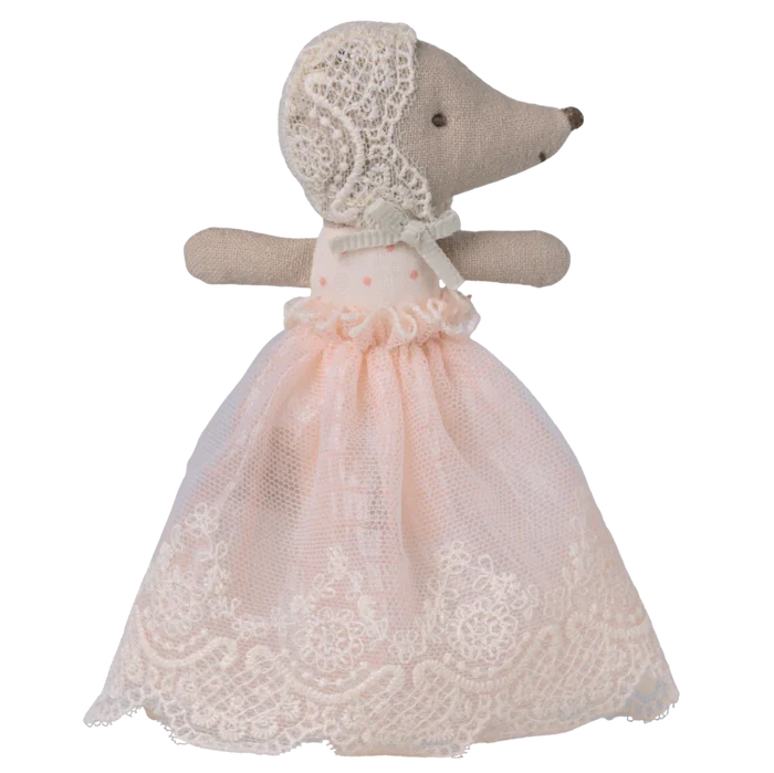 Toy mouse in a lace dress and bonnet on a white background