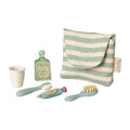 Set of mouse toiletries including a striped pouch, cup, bottle, toothbrush, and brush on a white background.