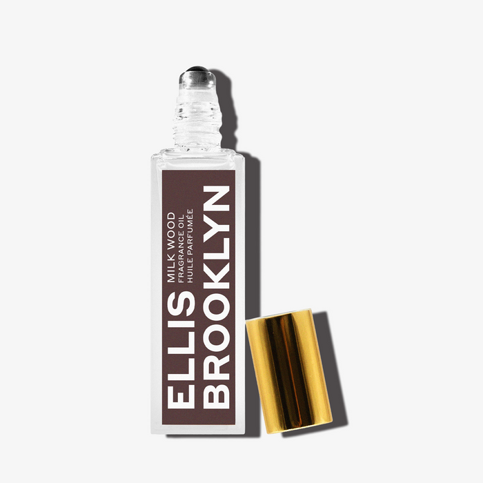 Milk Wood Fragrance Oil 15ml with cap removed on white background.
