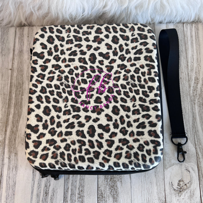 Mini  Leopard Print Fancy Band Storage Case — Case made of PU leather, Nylon, Multi spandex, Lycra Dimensions are W 9 1/4" x L 8 1/4" x H 2 1/4" This item is storage case only bands not included.
