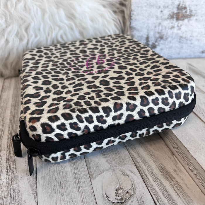 Mini  Leopard Print Fancy Band Storage Case — Case made of PU leather, Nylon, Multi spandex, Lycra Dimensions are W 9 1/4" x L 8 1/4" x H 2 1/4" This item is storage case only bands not included.