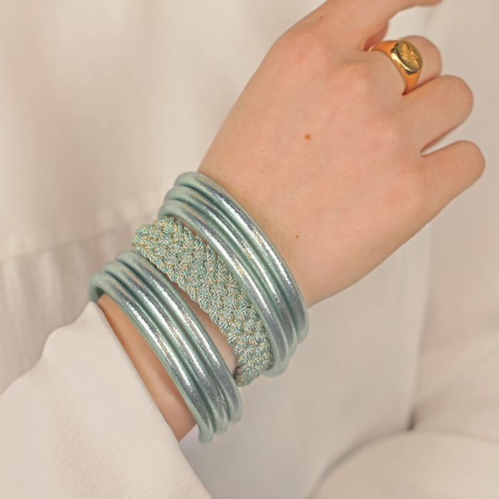 a hand wearing a bracelet