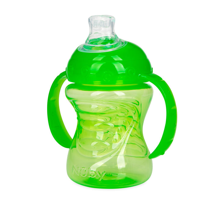 The Nuby No-Spill Soft Spout Grip N' Sip Trainer Cup is a green plastic cup for young children, featuring two handles, a clear silicone spout, a spiral pattern, and leak-resistant design with the Nuby logo embossed near the base.