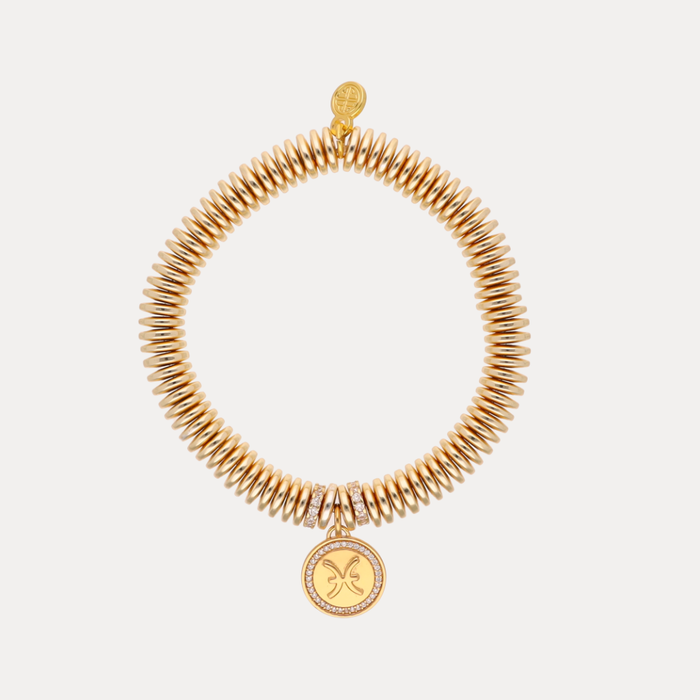a gold bracelet with a pendant