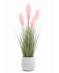 Artificial pampas grass close-up with blush pink plumes, green stems, and gray pot