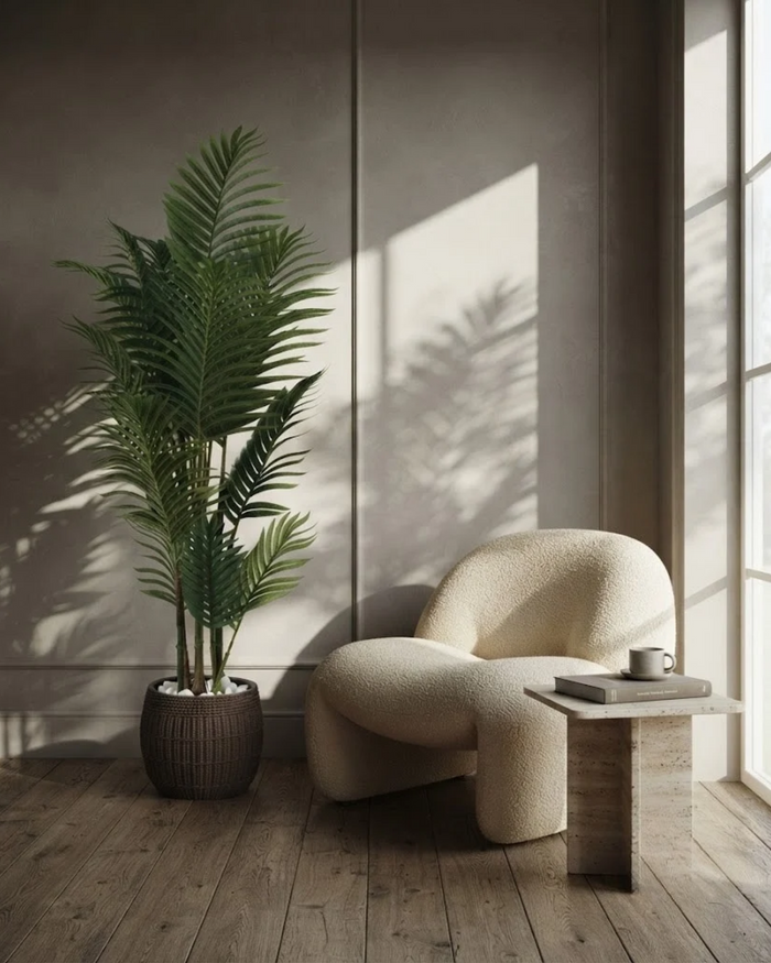 Tall artificial palm with green fronds in dark textured pot