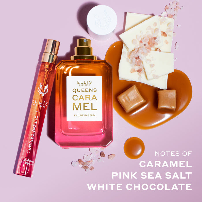 Queens Caramel 10ml Eau De Parfum Travel Spray next to Queens Caramel 50ml Eau De Parfum with cap removed, and melted caramel, caramel squares, pieces of white chocolate, and pink salt, above white text that reads "Notes of Caramel, Pink Sea Salt, White Chocolate" on light pink background.