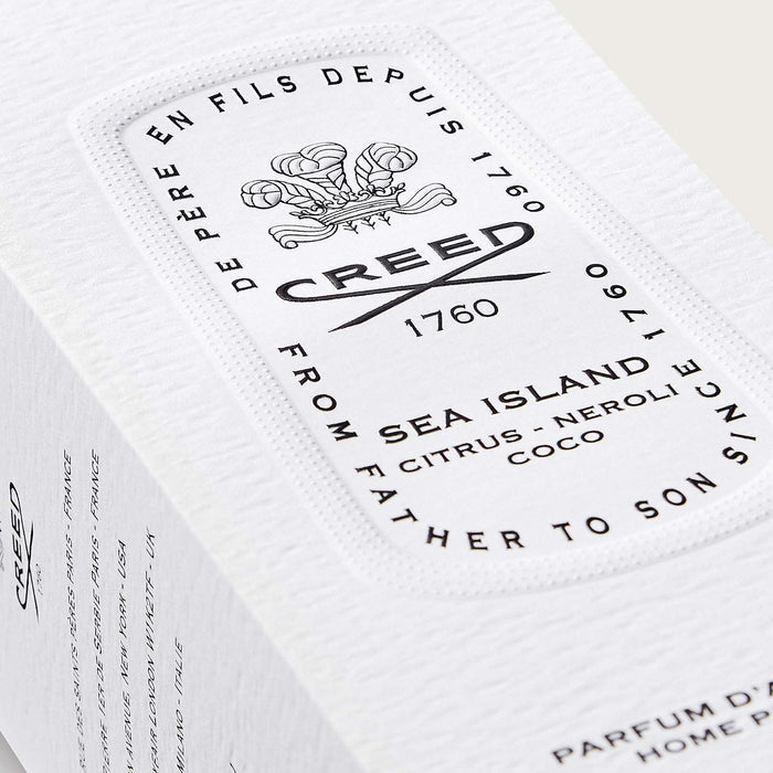 Creed Sea Island Room Spray Box - Angled Label Close-Up, Textured White Packaging | Creed Boutique