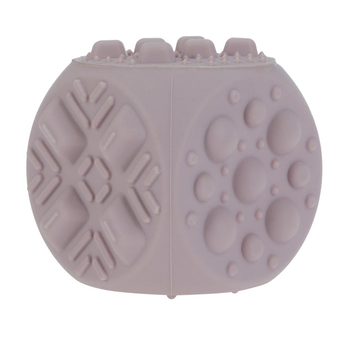 Nuby US Silicone Popper Blocks (2 Pack) are light purple, oval-shaped silicone sensory toys with raised geometric and circular patterns, designed to support babies' fine motor skills.