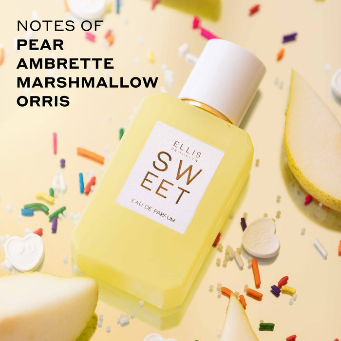 Sweet 50ml Eau De Parfum and Sweet 10ml Eau De Parfum Travel Spray on yellow background with rainbow sprinkles, white heart candies, and sliced pears with black text that reads "notes of pear, ambrette marshmallow, orris"