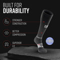 Tall black and gray compression merino wool sock displayed with durability features