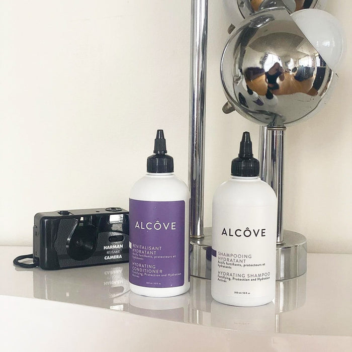Alcove Hydrating Shampoo bottle and Conditioner bottle side-by-side